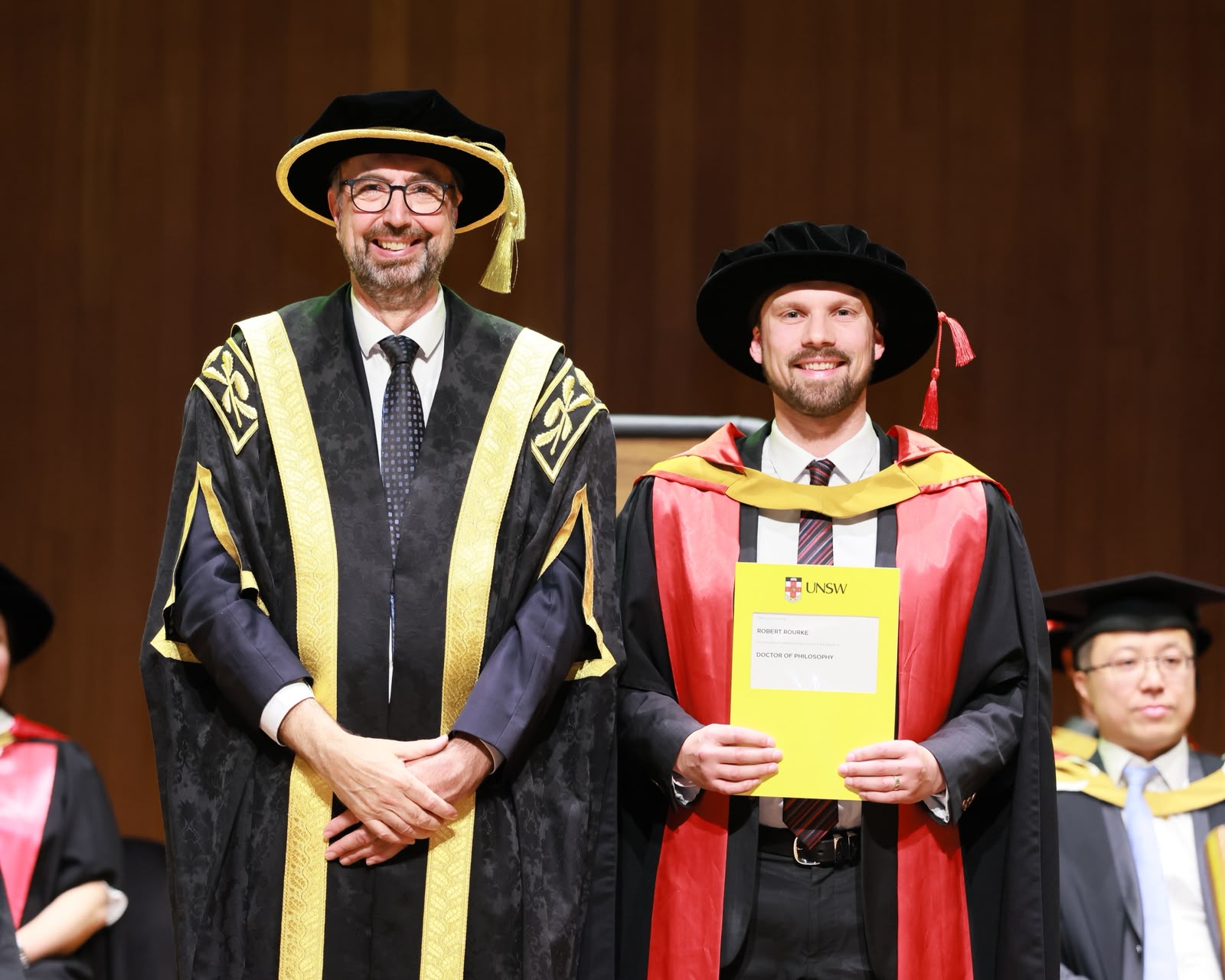 Dr Robert Rourke on stage at PhD graduation