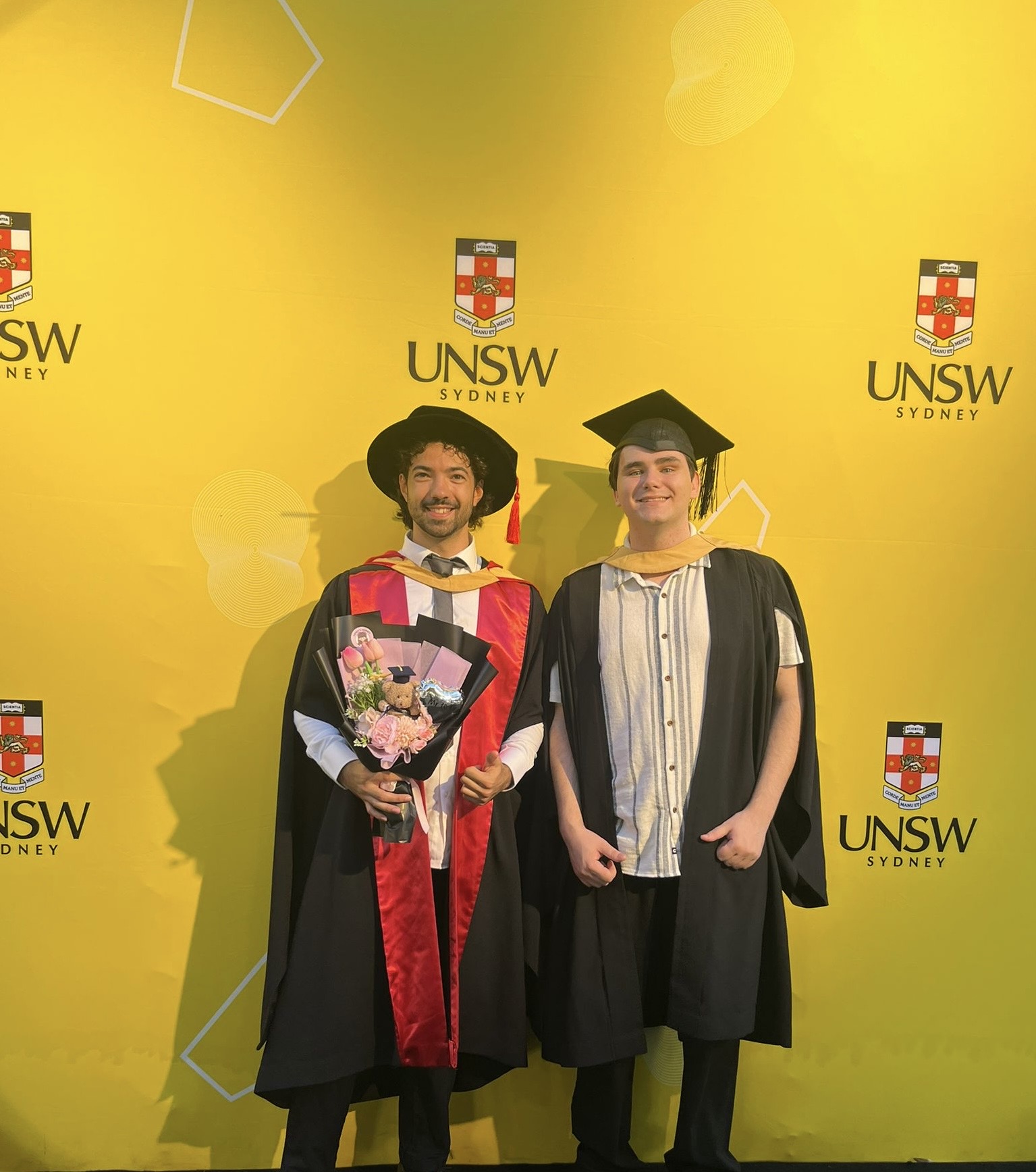 Dr. Valerio Falasca (PhD) and Josh Fleming (Honours) at graduation